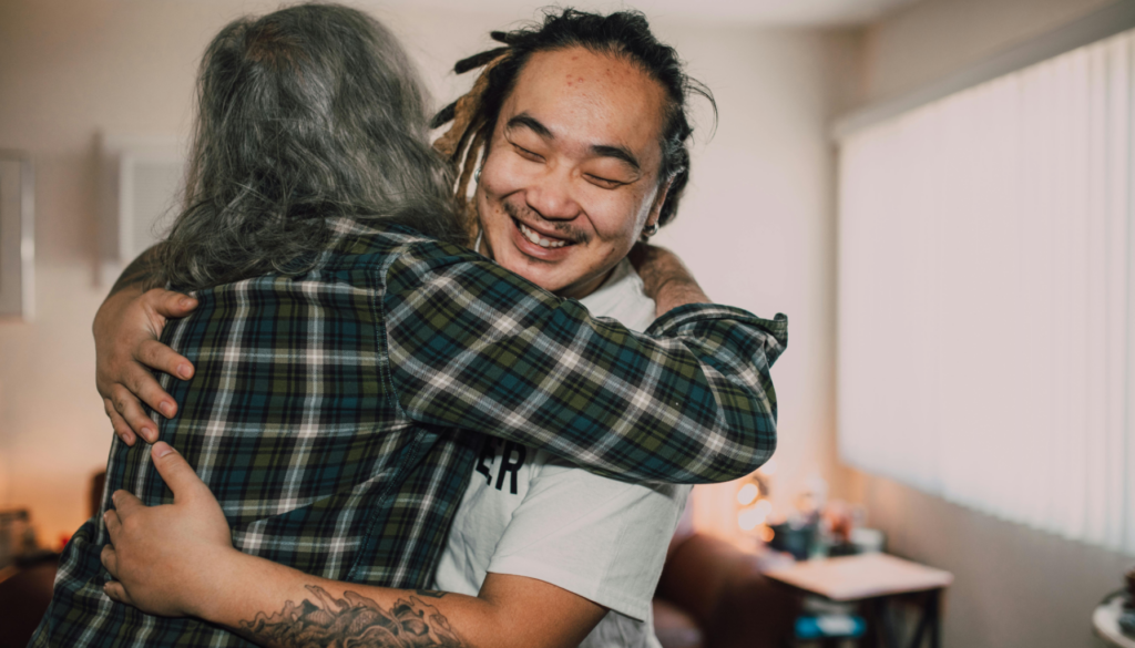 A non-profit worker celebrates finding housing for someone in need