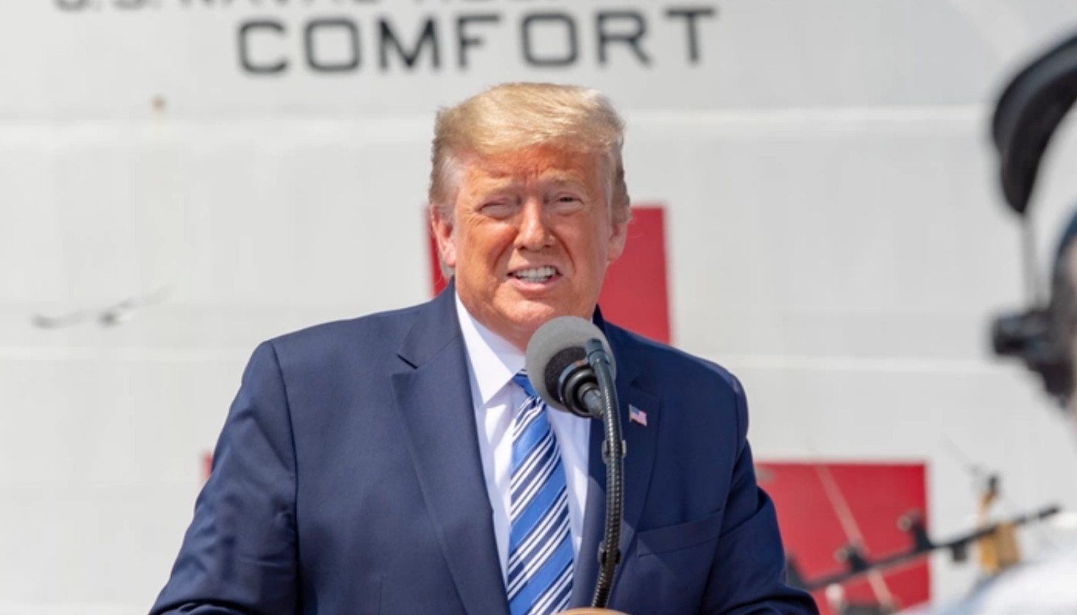 Donald trump speaking at a podium